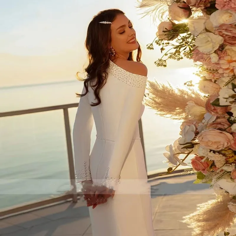 Vestidos de novia de sirena de satén de lujo para mujer, vestido de novia de manga larga con cinturón de cuello de perlas, vestido de tren de corte plisado, novedad de 2024