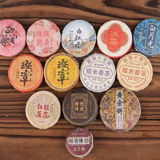 

Новая модель чая Шу Пуэр: маленький круглый блин, красочный дизайн, различные виды черного чая Пуэр из Юньнани