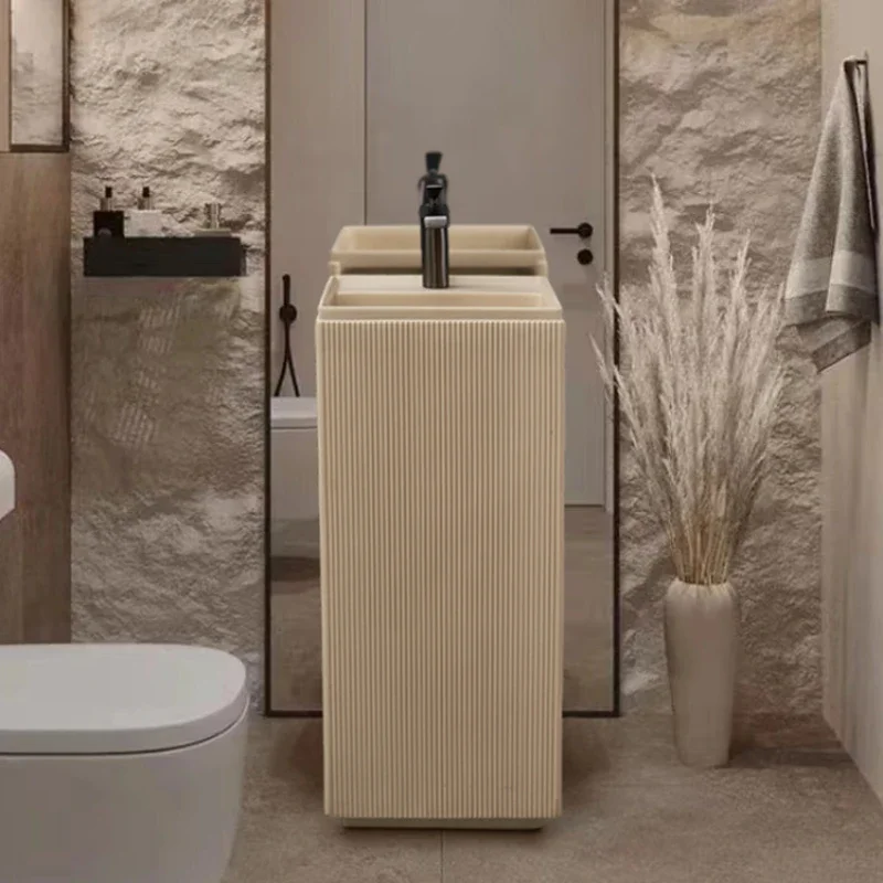 

Column basin integrated floor standing washbasin, cream air outdoor