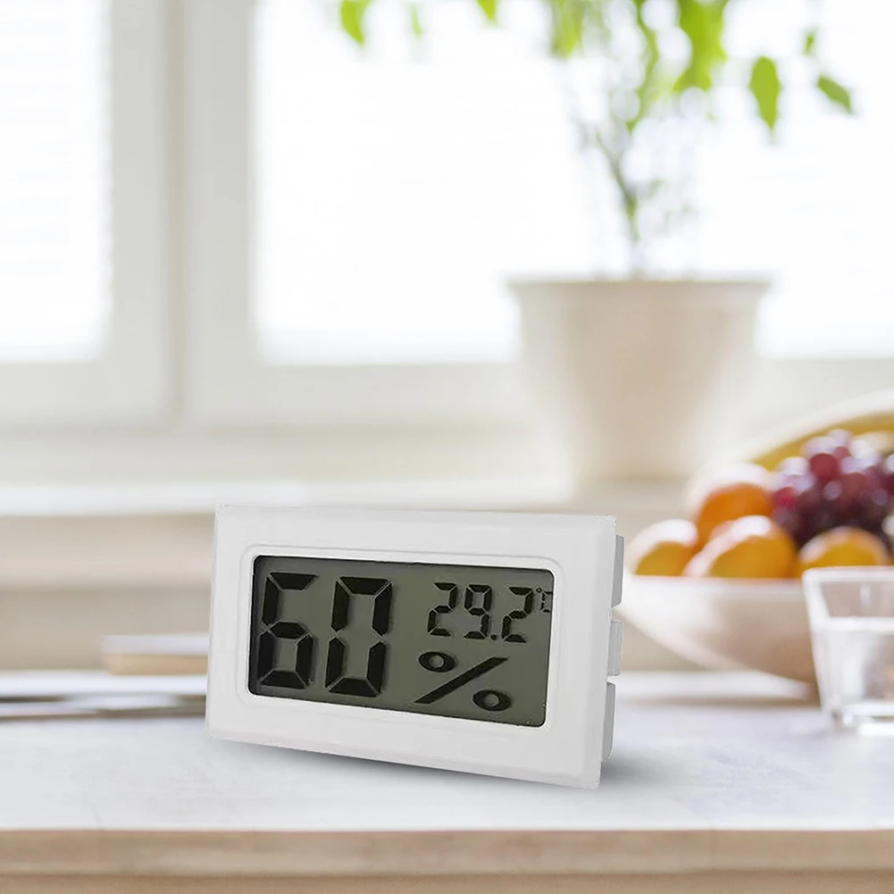 Portable digital temperature and humidity sensor with accurate readings and large LCD display designed for indoor monitoring