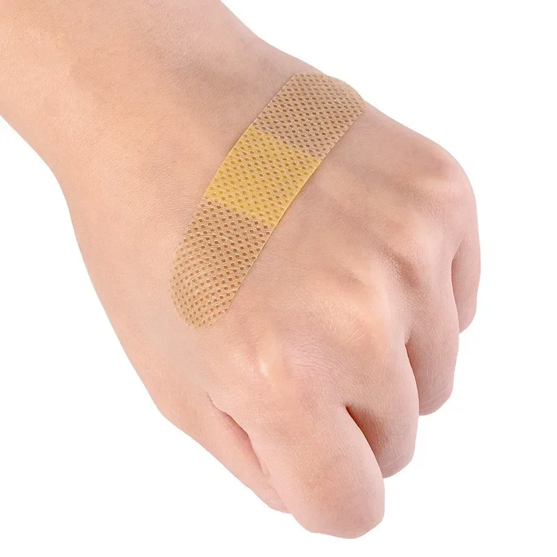 Patch de Band Aid não tecido para primeiros socorros, gesso impermeável, Woundplast, ataduras adesivas, tiras, fita adesiva, 100pcs por pacote