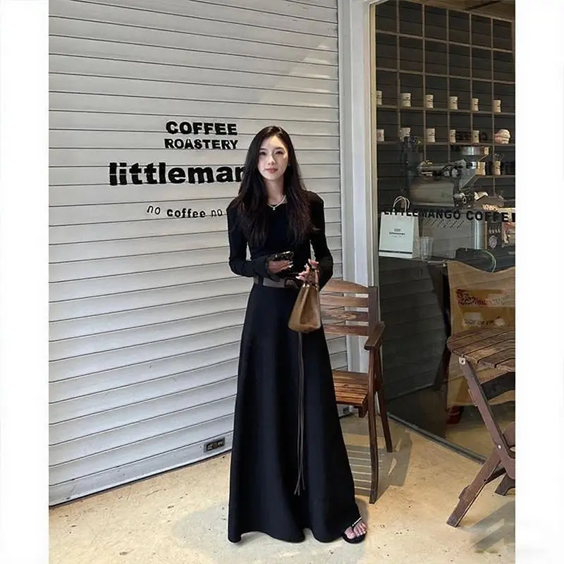 Modna, uniwersalna, wyszczuplająca spódnica w kształcie litery A, długa, damska, w stylu francuskim, niszowa, z wysokim stanem, zwisająca, do połowy łydki.