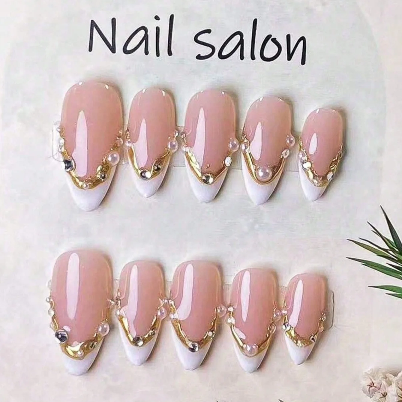 10 Pieces of Handmade Almond-Shaped Fake Nails, Featuring Irregular White French Tips Outlined with Golden 3D Lines. Hand-Painte