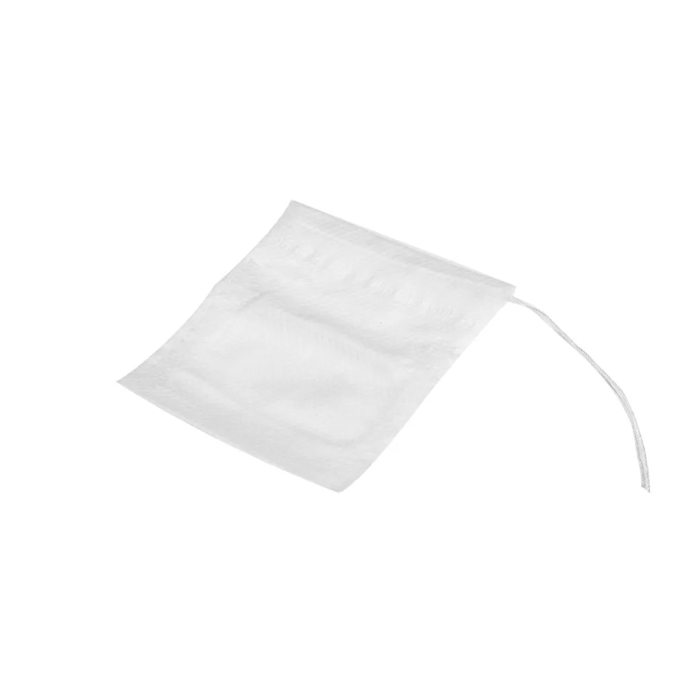 Drawstring Closure Empty Tea Bags Non-Woven Material 5.5*7cm Size Drawstring Tea Bags White Color Disposable Design