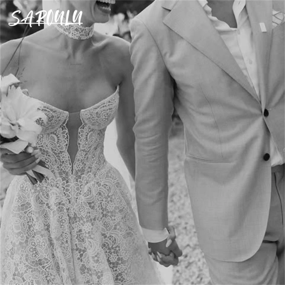 ボヘミアンレースのウェディングドレスビーチストラップレスカスタマイズされたロング花嫁ドレス傑作高品質のブライダルドレスコートトレイン付き