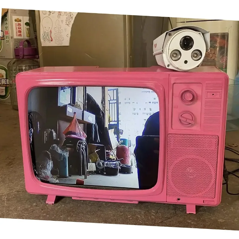 Old-fashioned black and white TV, LCD screen playback, wedding exhibition window display