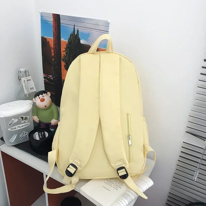 Bolsa de escola de nylon simples com zíper sólido de alta capacidade Mochilas de moda para meninos e meninas, linha de costura, 2024