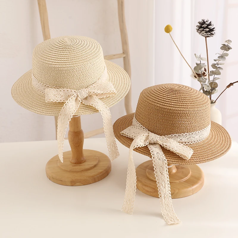 Nowy dziecięcy letni kapelusz przeciwsłoneczny Bucket Cap Simple Beige Lace Bowknot Ribbon Flat top Straw Hat Beach Outing Caps Panama