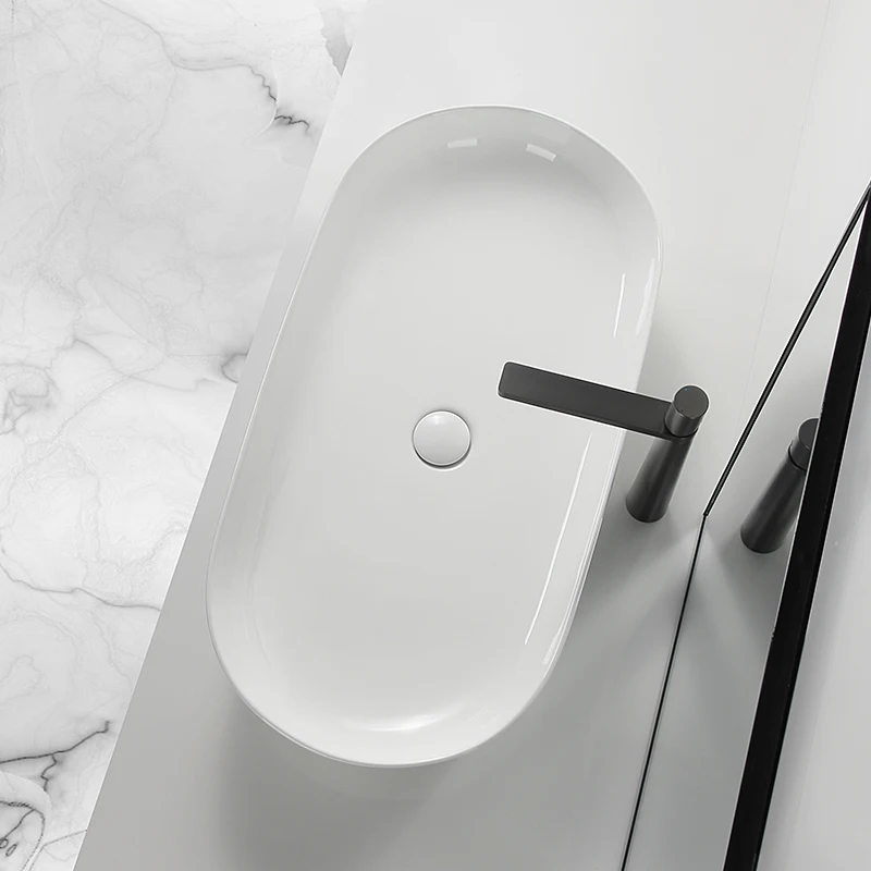 

Simple white large ultra-thin countertop basin Oval wash basin Bathroom washbasin Ceramic washbasin Basin