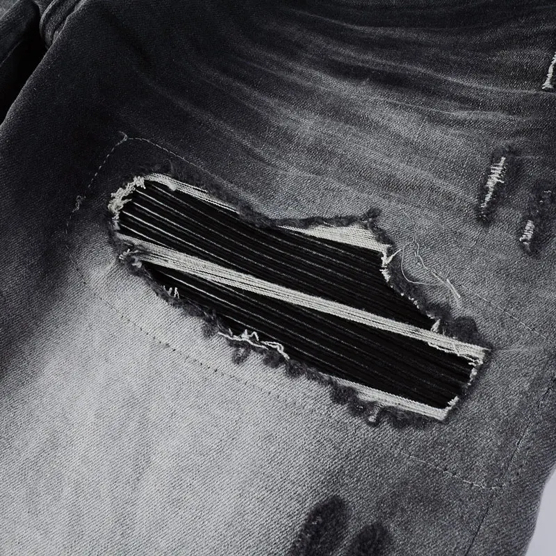 

Designer's new men's jeans Punched black leather patch washed retro black jeans High quality pants from street hip-hop brand