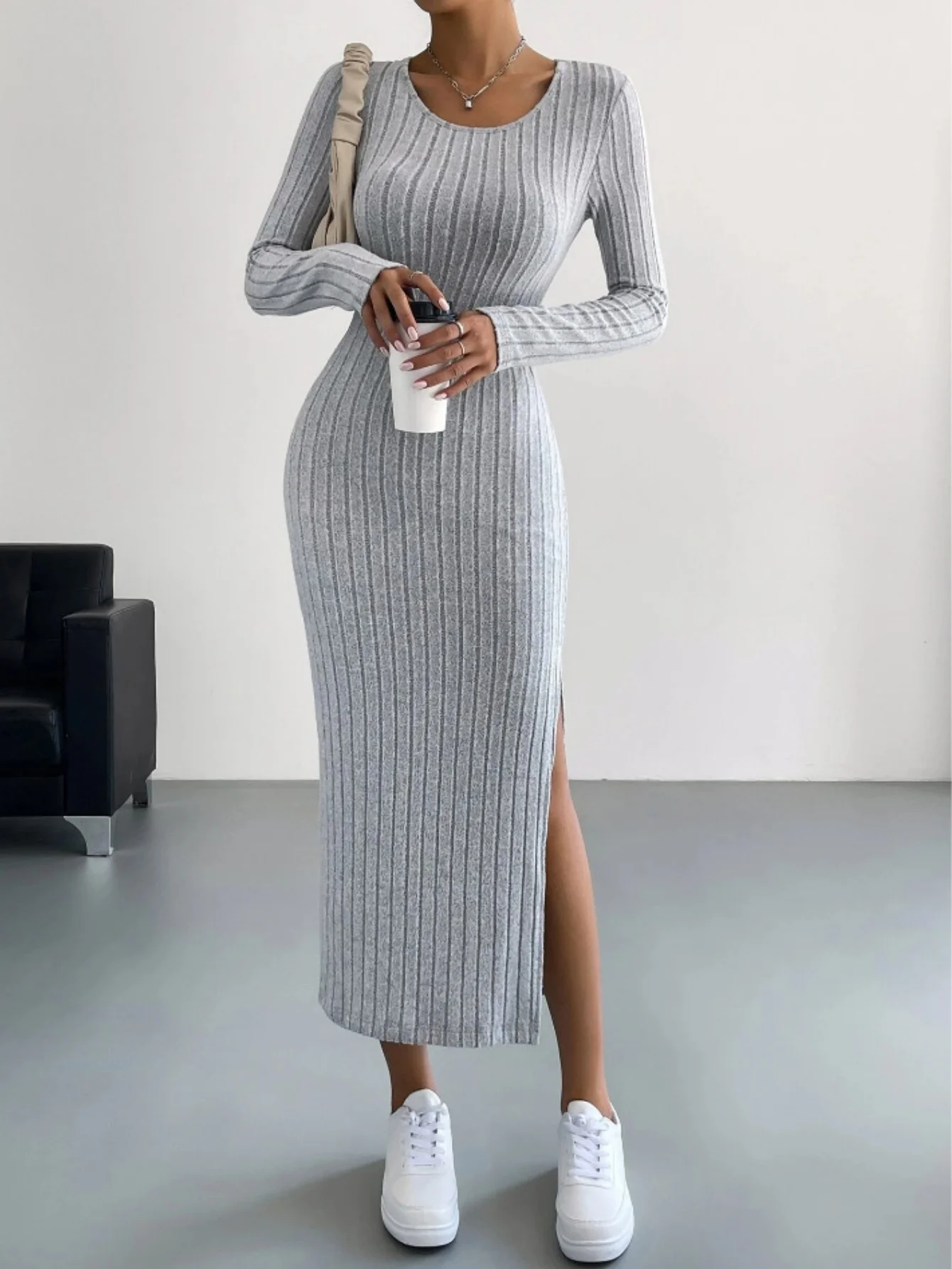 Front view of striped long sleeve knit maxi dress with side slit