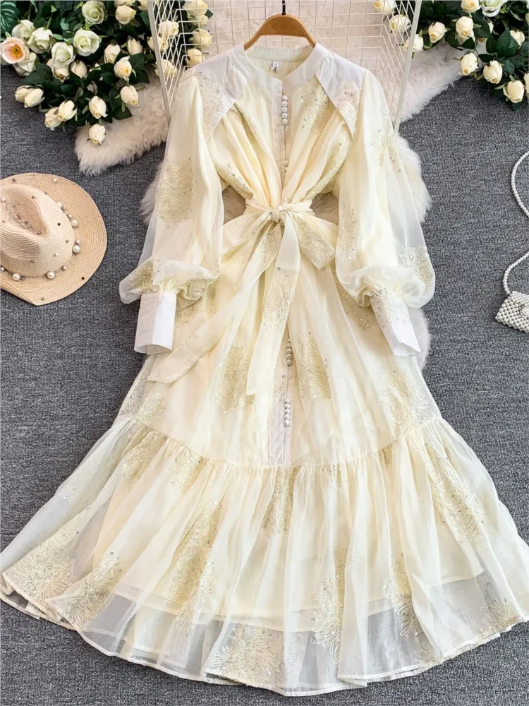 

Gentle and elegant embroidered stand-up collar lantern sleeves cinched waist ruffled skirt