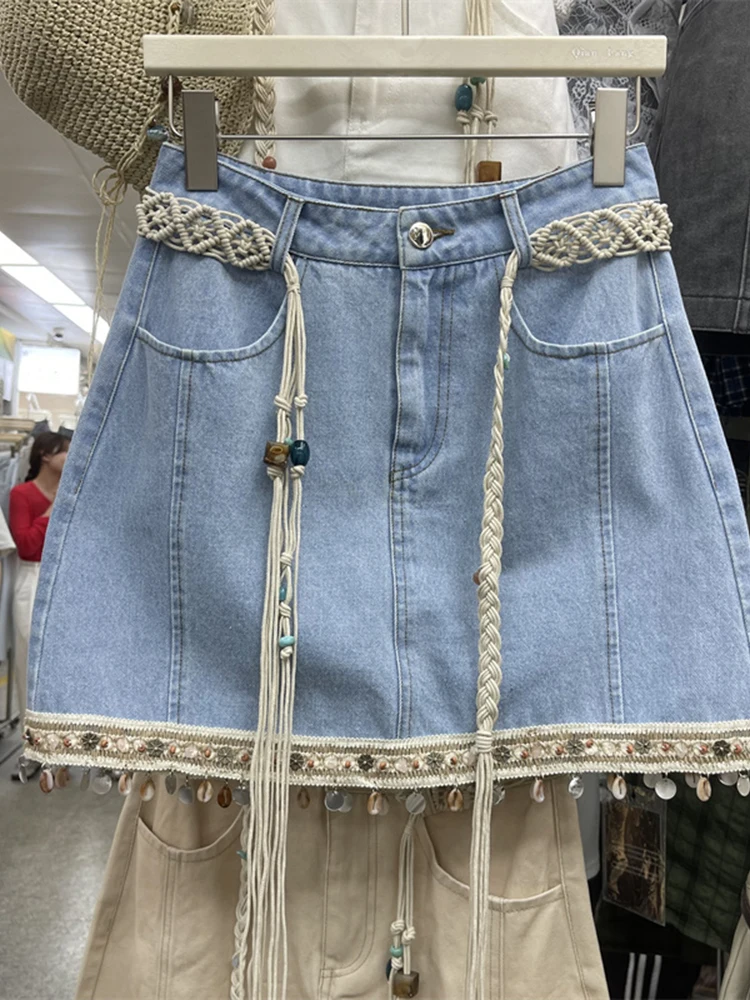 Summer 2025 New Fashion Women Denim Skirts Bohemian Style Weaving Edge Pendant Tassel A-line High Waist Short Skirt