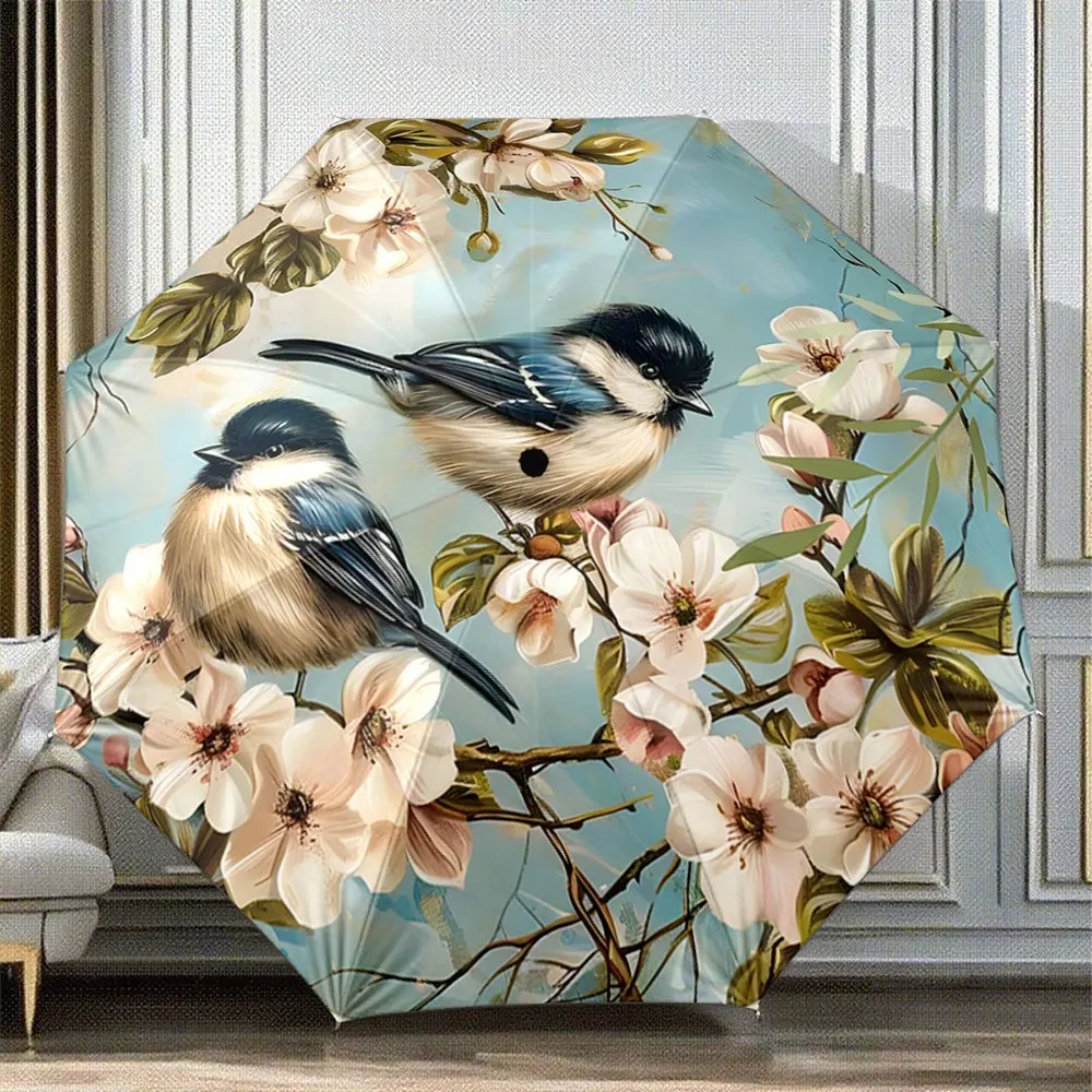 

Складной зонт. Складной зонт с рисунком распускающихся цветов и птиц, которые как бы сидят на ветке, включая виды, такие как Blu.