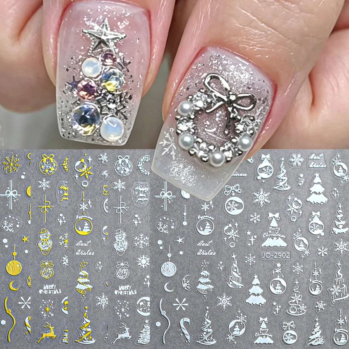 Gold and silver snowflake nail stickers; holographic nail decorations featuring snow globes, bells, and stars; Christmas nail ar