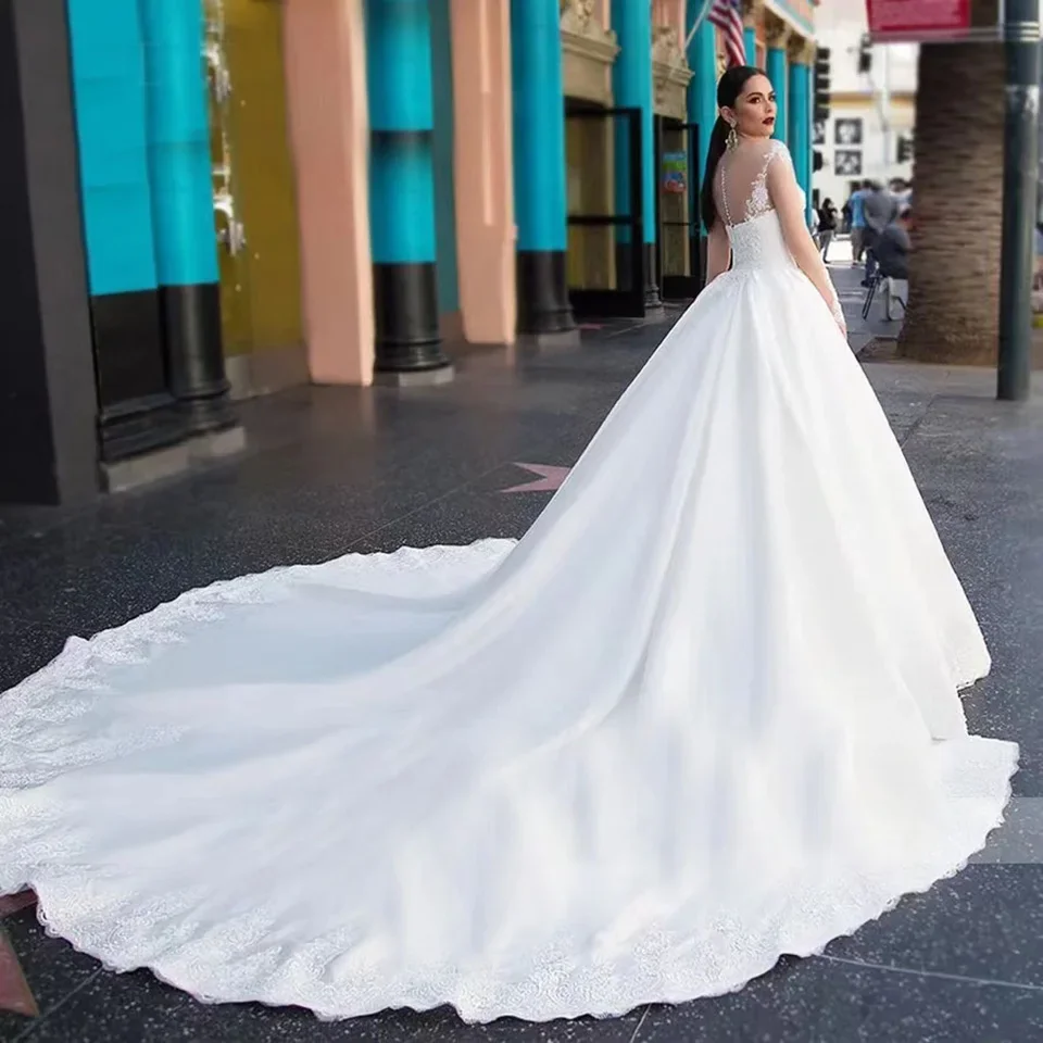 

Customized Elegant Princess Lace Wedding Dresses Illusion Long Sleeves Buttons Court Train Tulle Bridal Gowns For Women