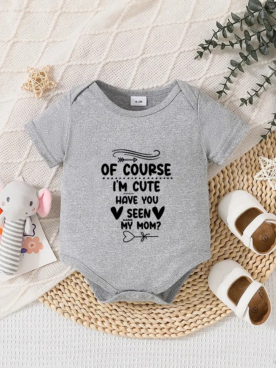 Playful letter-printed baby short-sleeve triangle bodysuit. Button closure for easy dressing, machine washable