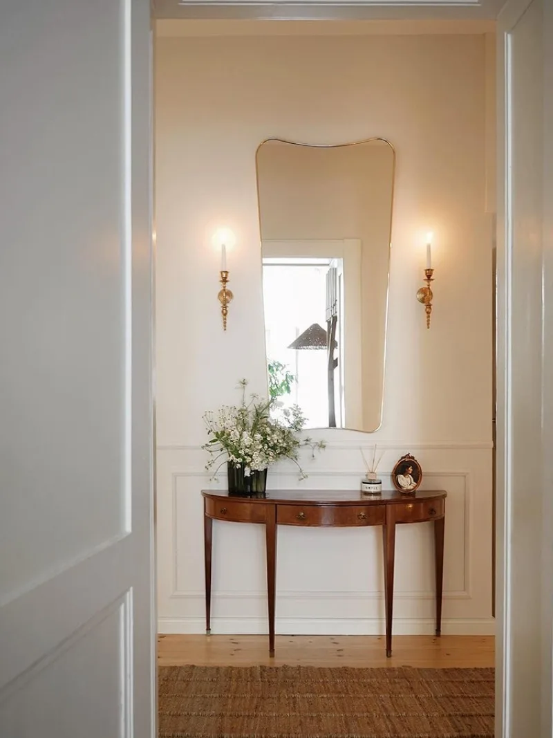 solid wood extremely narrow entrance platform, entrance corridor against the wall, narrow cabinet, retro curved entrance table