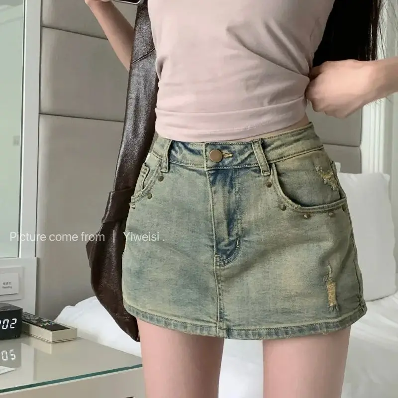 

2024 new summer style retro nostalgic rivet elastic irregular hole denim skirt for women with lining