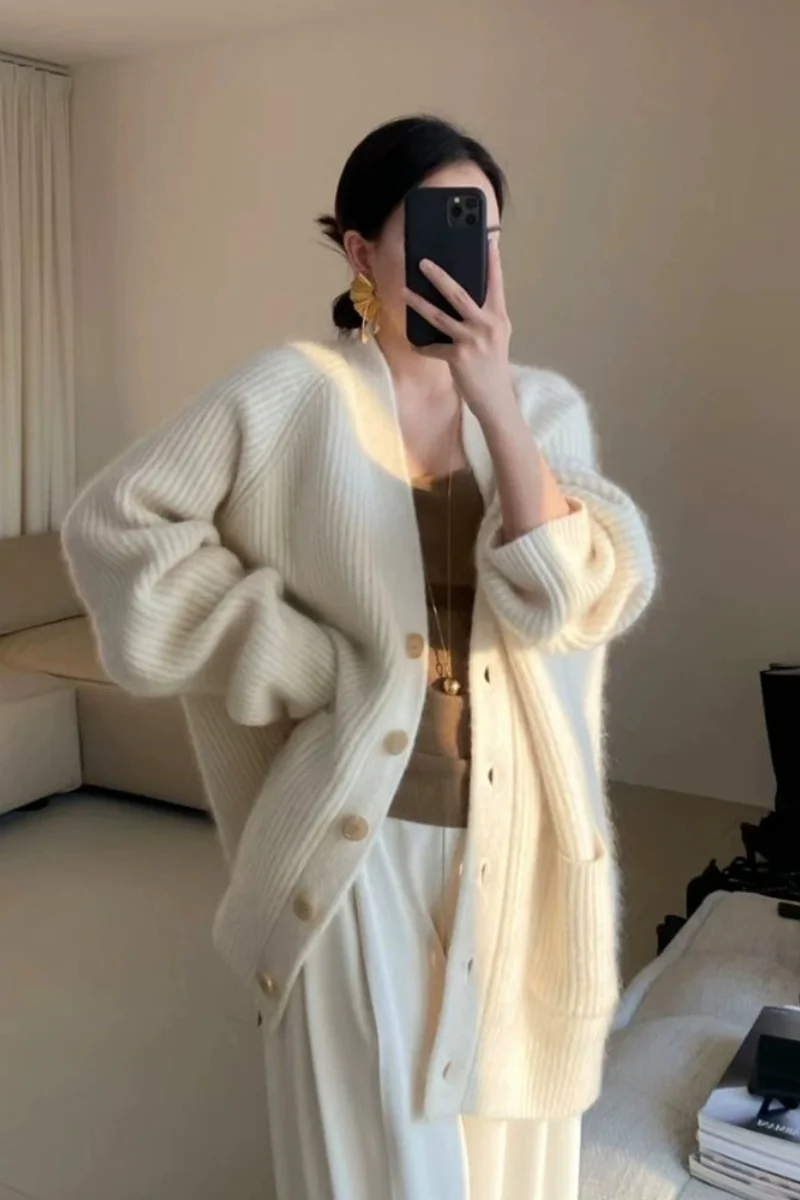High-grade white sweater cardigan coat women's autumn and winter temperament loose thick long V-neck sweater outside.