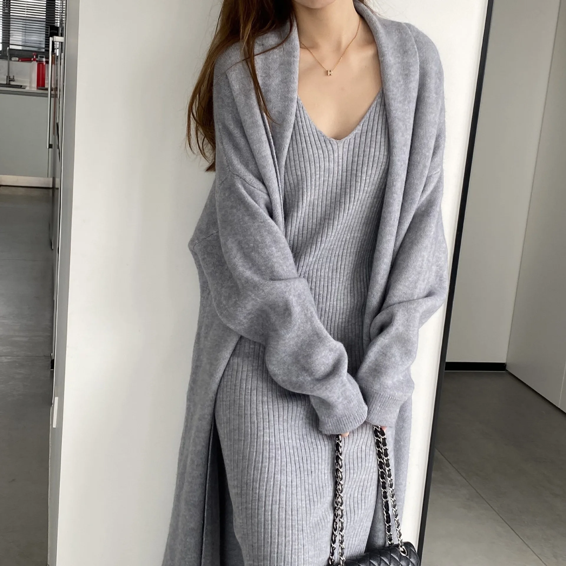 

2025 Knitted Dress Autumn and Winter New Fashion Women's Wear Long Sweater Cardigan and Hip Wrapping Strap Skirt Two Piece Set