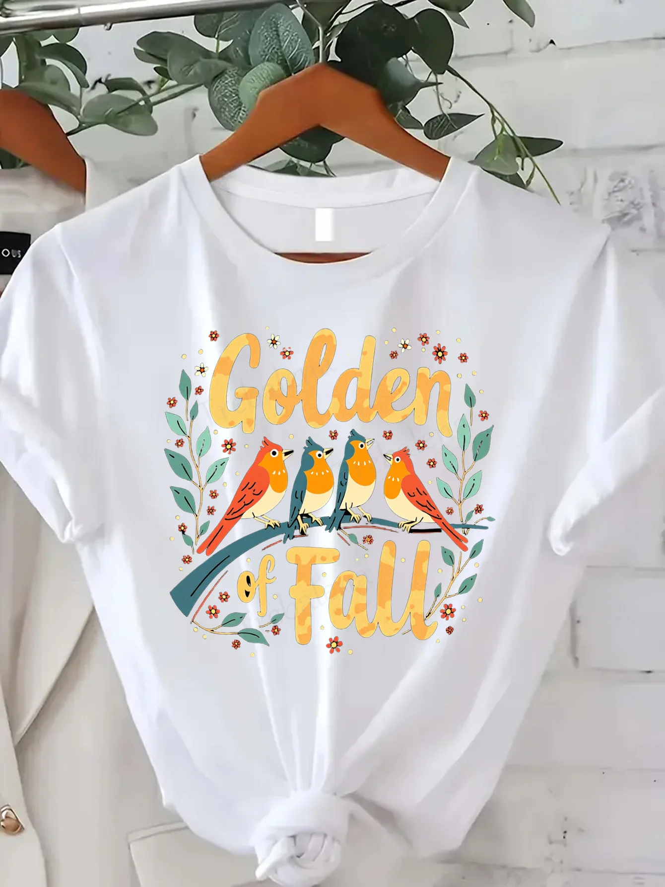 

Comfortable Women's Print T-shirt "Golden Fall T-Shirt with Colorful Birds and Floral Design for Women"