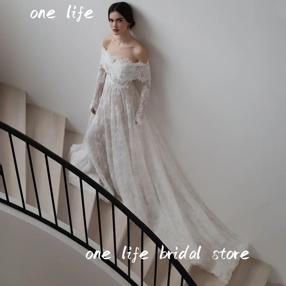 فستان زفاف دانتيل عربي رائع من OL مخصص قبالة الكتف وأكمام طويلة لؤلؤي على شكل حرف A مشد فستان زفاف عربي