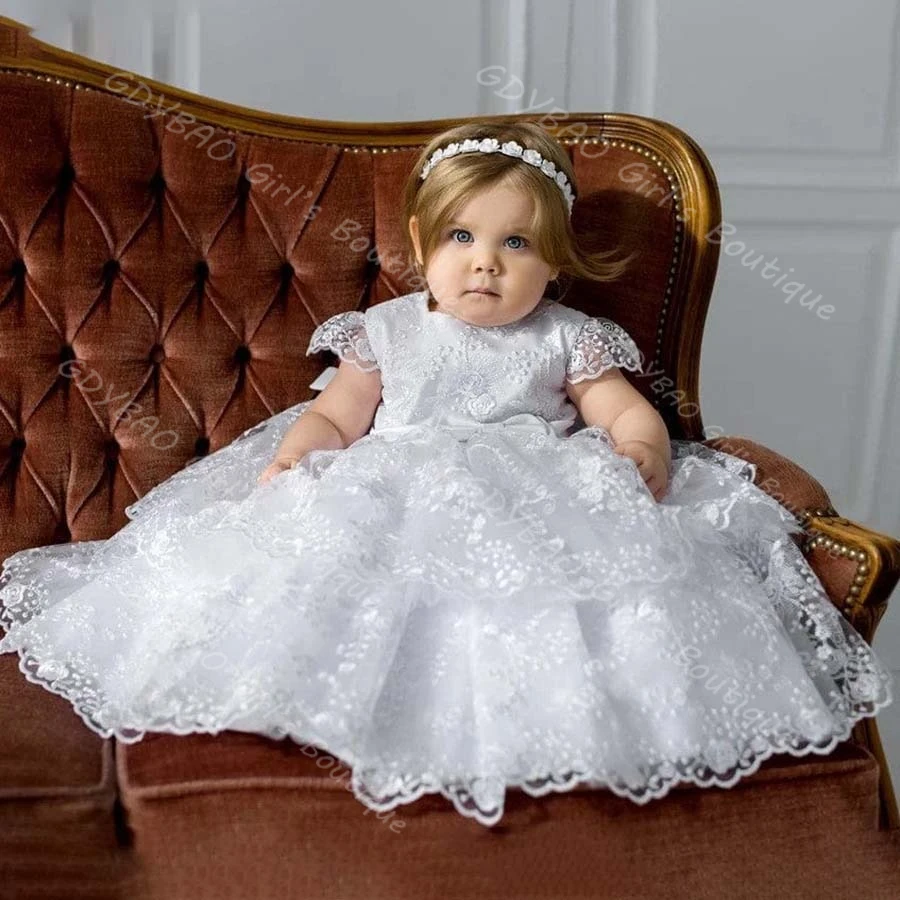 فستان التعميد من الدانتيل المتدرج للأطفال الصغار بأكمام قصيرة وشاحات على شكل فيونكة فستان التواصل المعمودي 0-6T للأطفال مخصص على شكل زهرة للفتيات فستان الحفلات