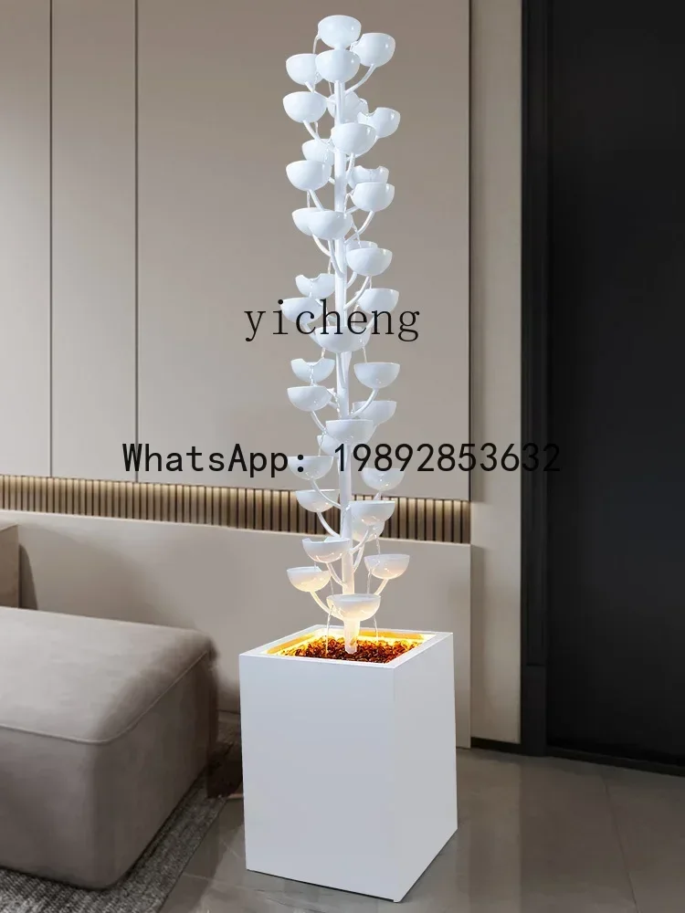 large floor-to-ceiling flowing water ornament indoor fountain living room TV cabinet next to water feature decoration