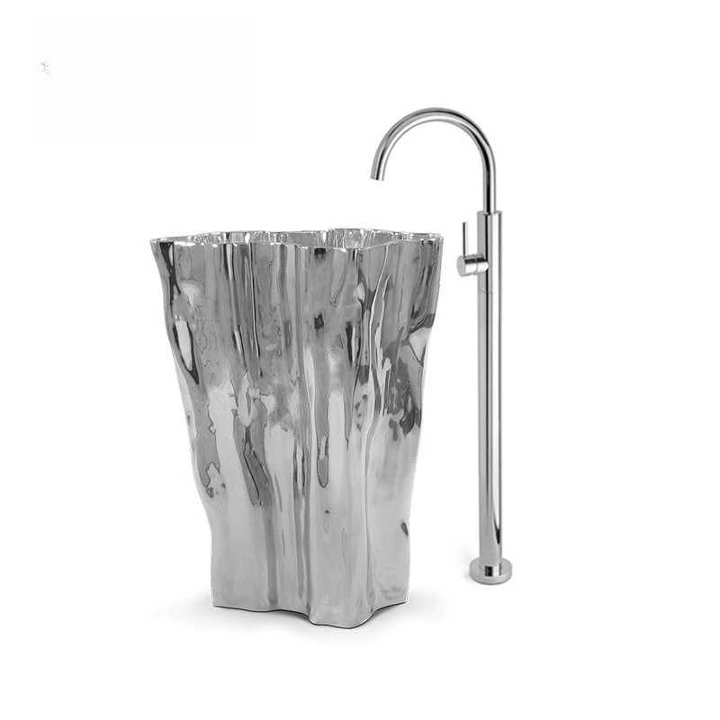 

Stainless steel washbasin against the wall