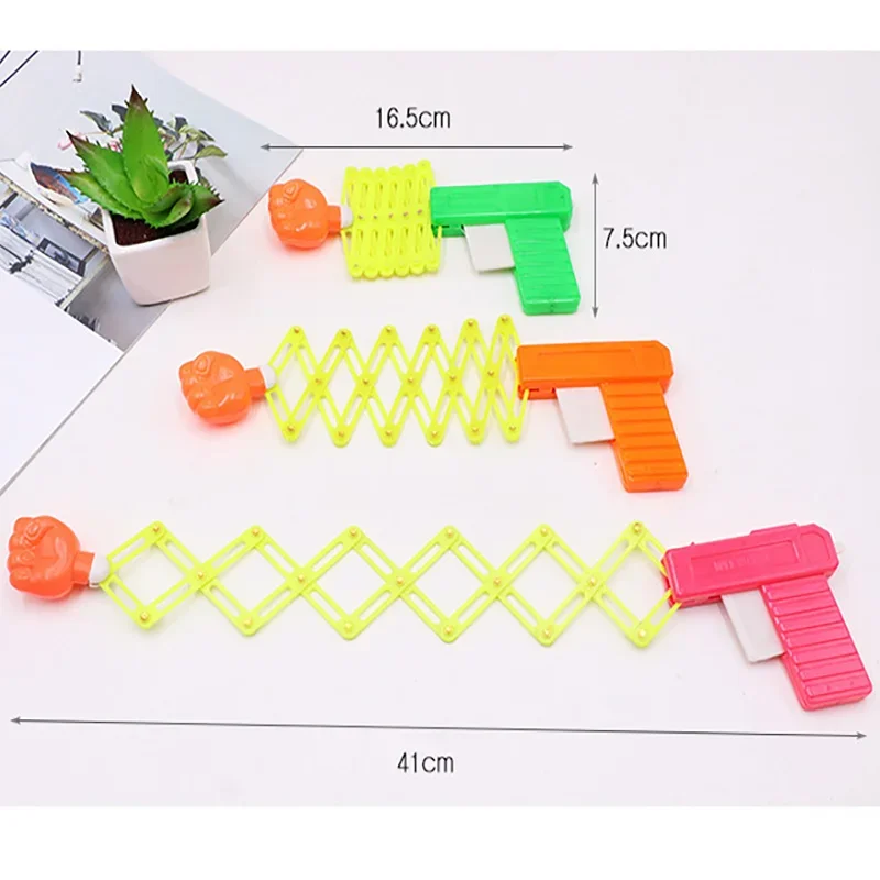 Speelgoed Vuistgeweer Kinderplezier Nieuwigheid Klaslokaal Onderwijs Grappig Vingerlezen Rekwisieten Nostalgische jeugdherinneringen Klassiek speelgoed