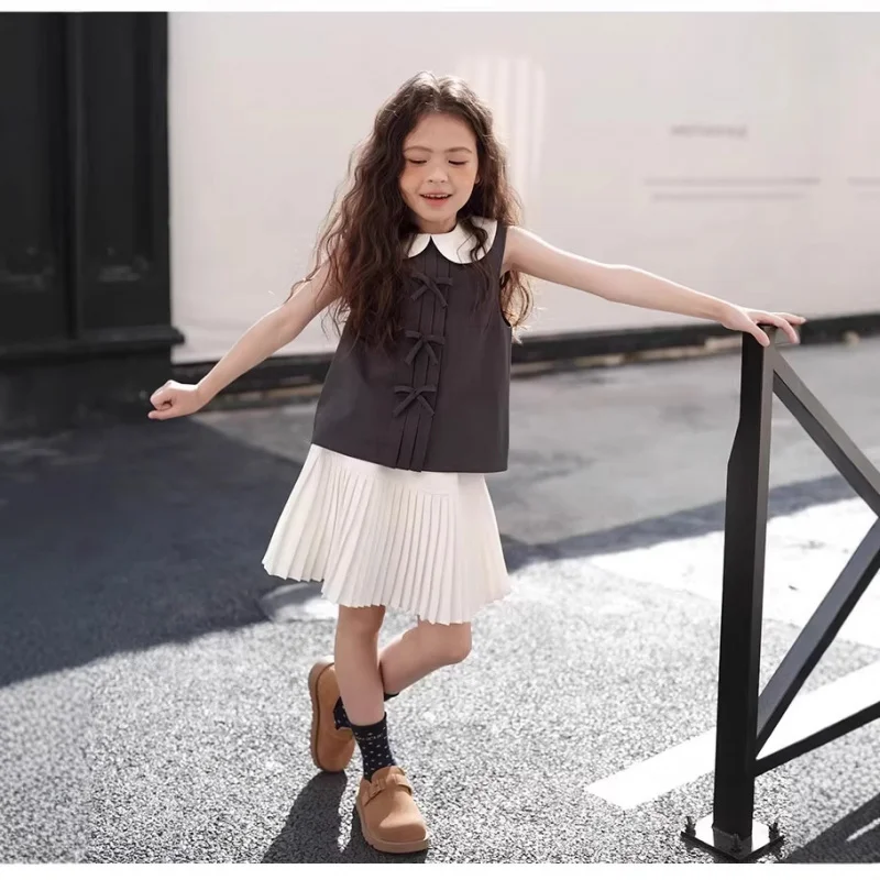

Children's clothing for girls: doll collar bow fashion top with pleated skirt2026Summer New