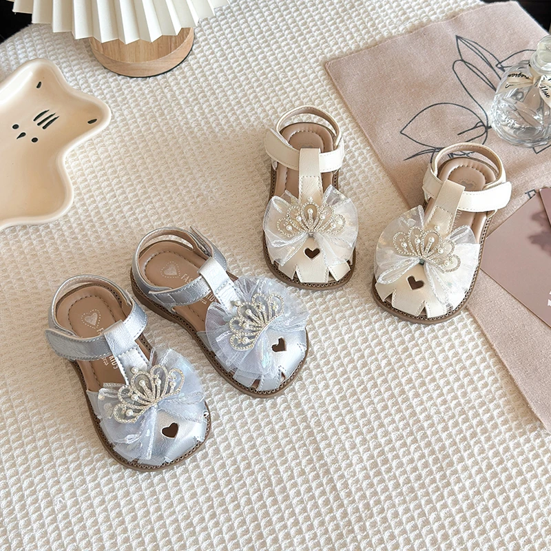 

Детские сандалии для девочек «Принцесса» Лето 2026: Элегантные туфли с короной и бантом, повседневные, нескользящие, размеры 21-30