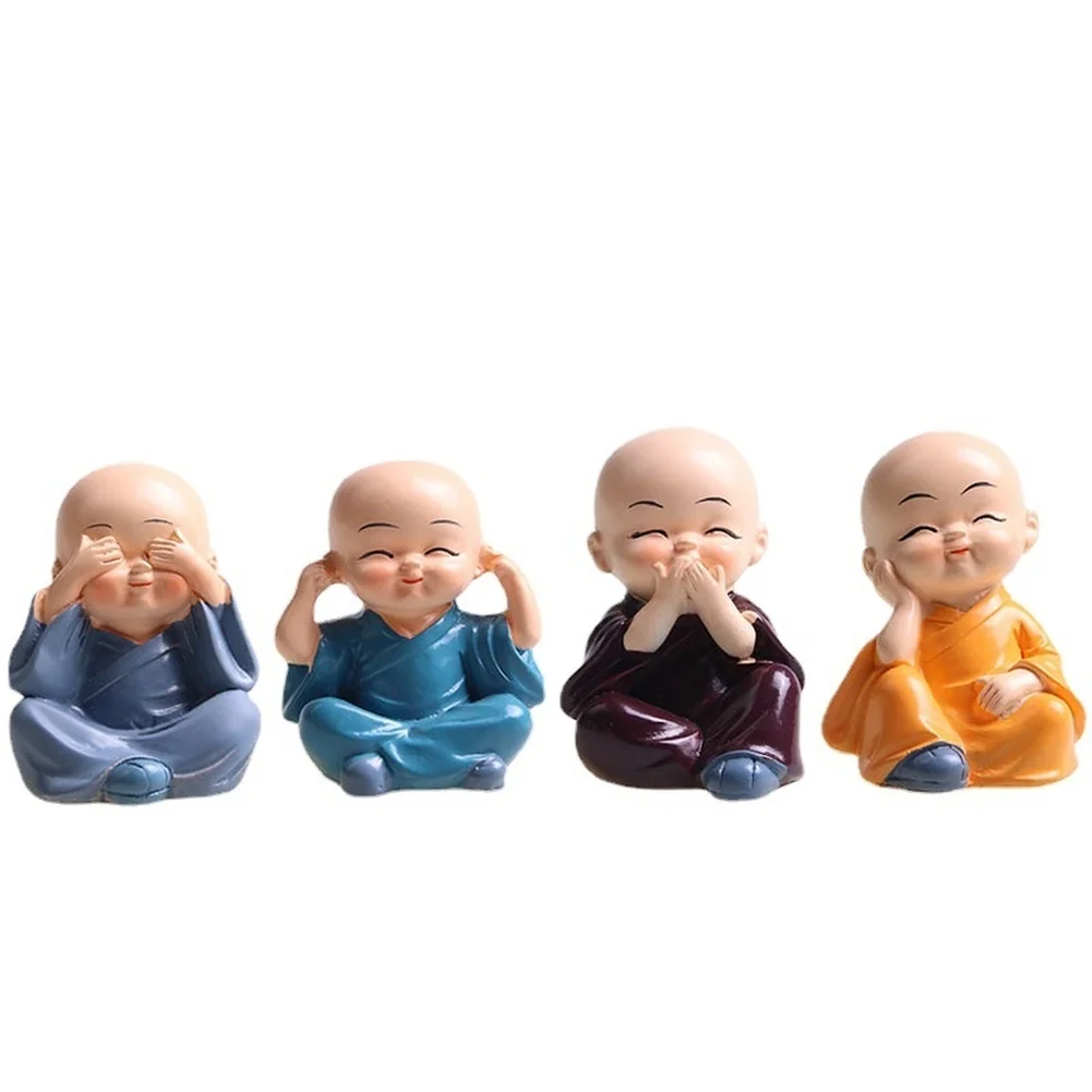 Four multicolored baby Buddha monk statues made of lucky wood resin ideal for car dashboard and small decorative spaces