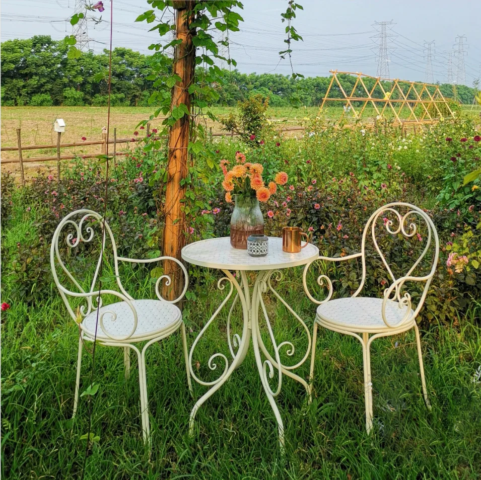 

Simple wrought iron balcony table and chairs three-piece set