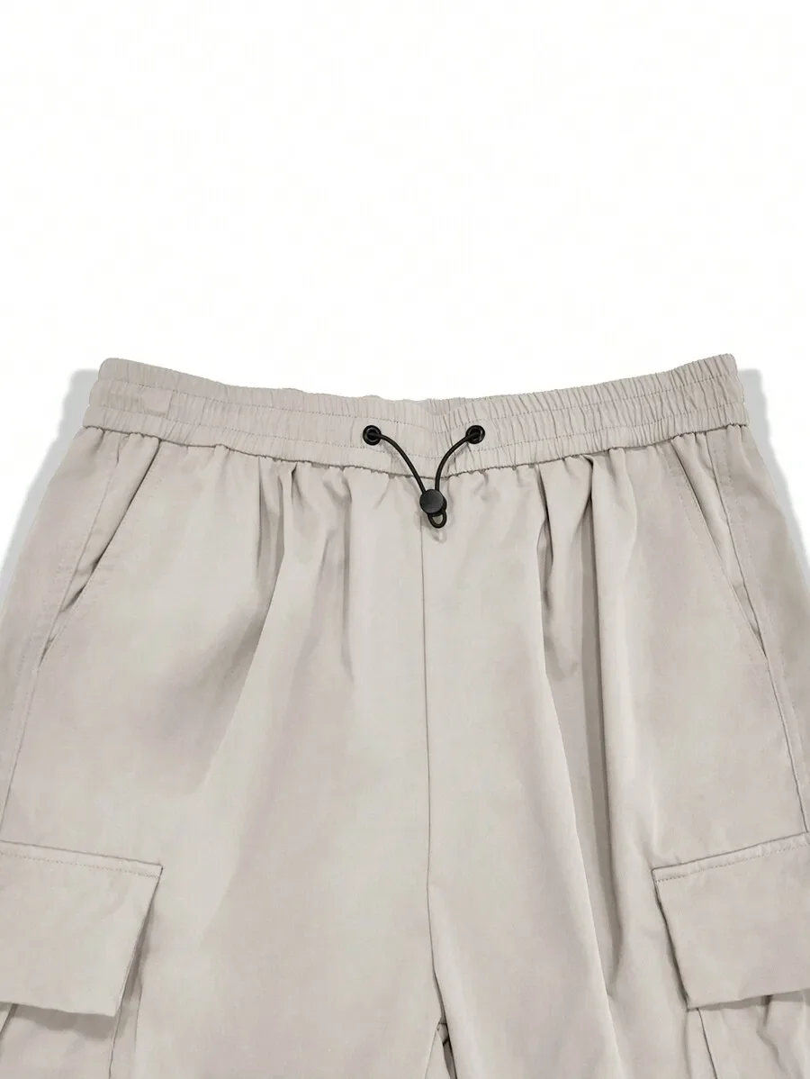 

Men Flap Pocket Side Drawstring Waist Oversize Cargo Pants For Fall