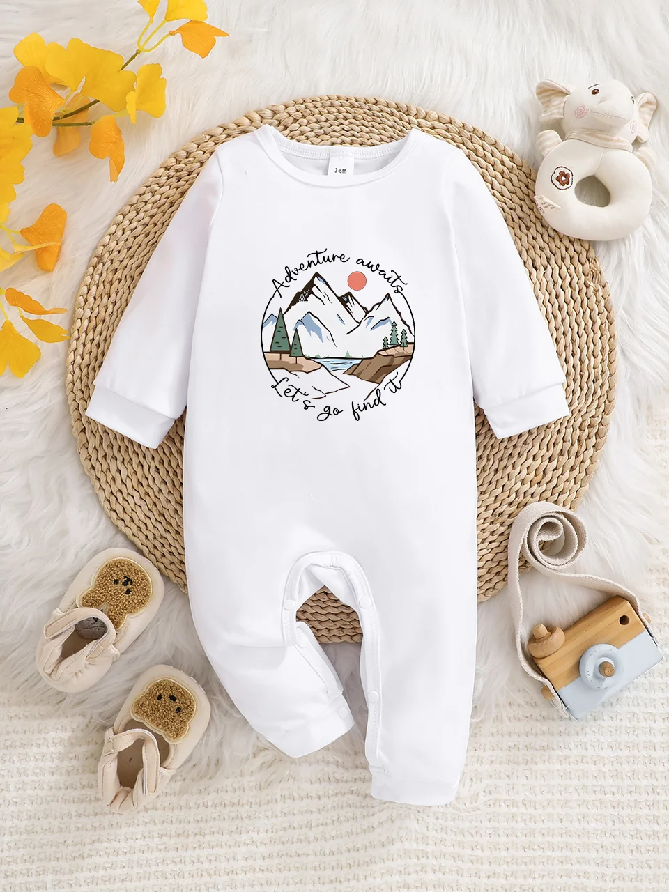 A baby long-sleeved onesie with interesting letter prints. It features a buttoned design for easy putting on and taking off