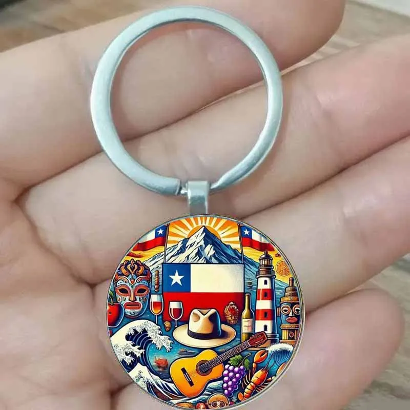 

Retro Chilean flag keychain with vibrant cultural and natural landscape design, featuring mountains, lighthouses, guitars, and m