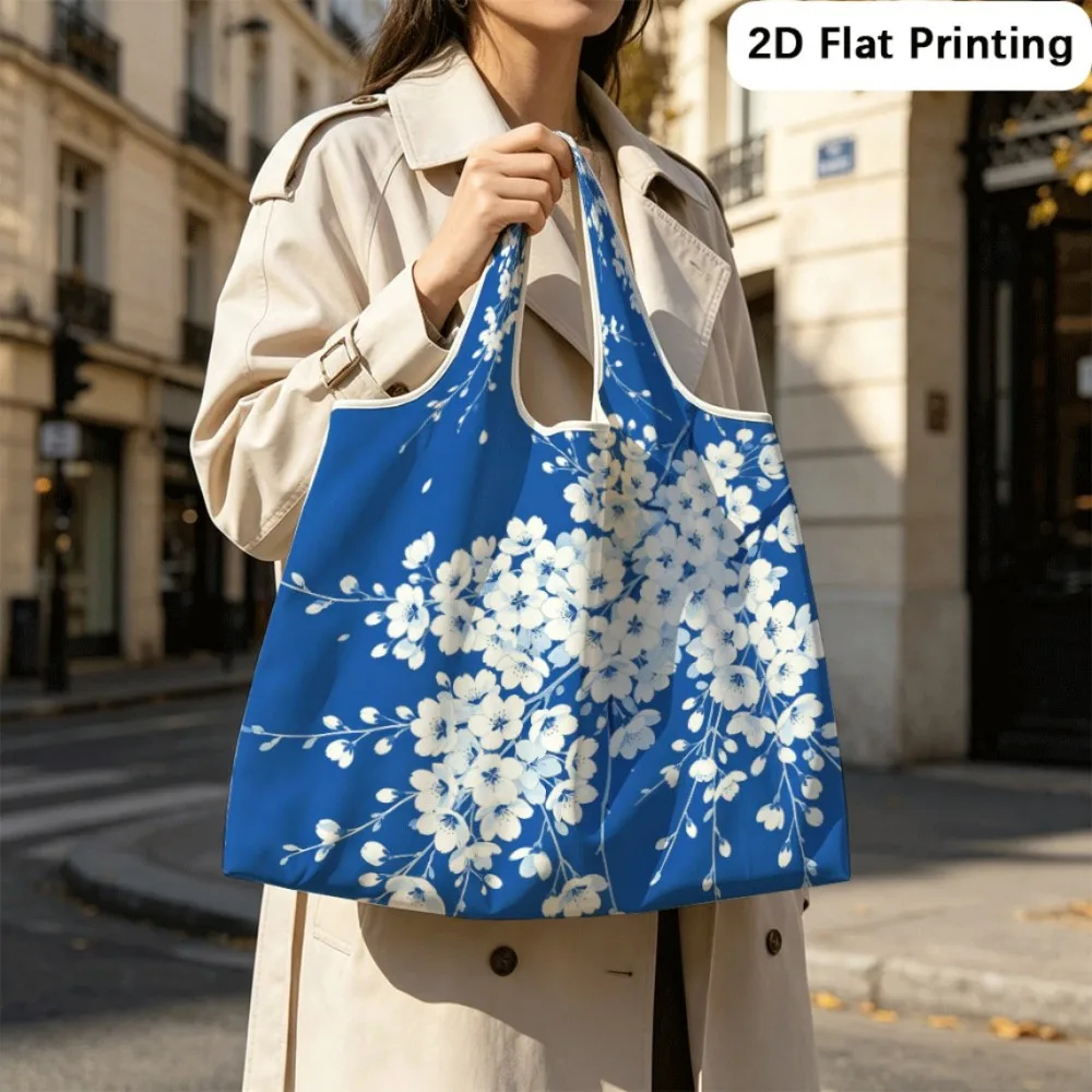 Blue Hanging Cherry Durable foldable tote shoulder bag, holds books and travel items.