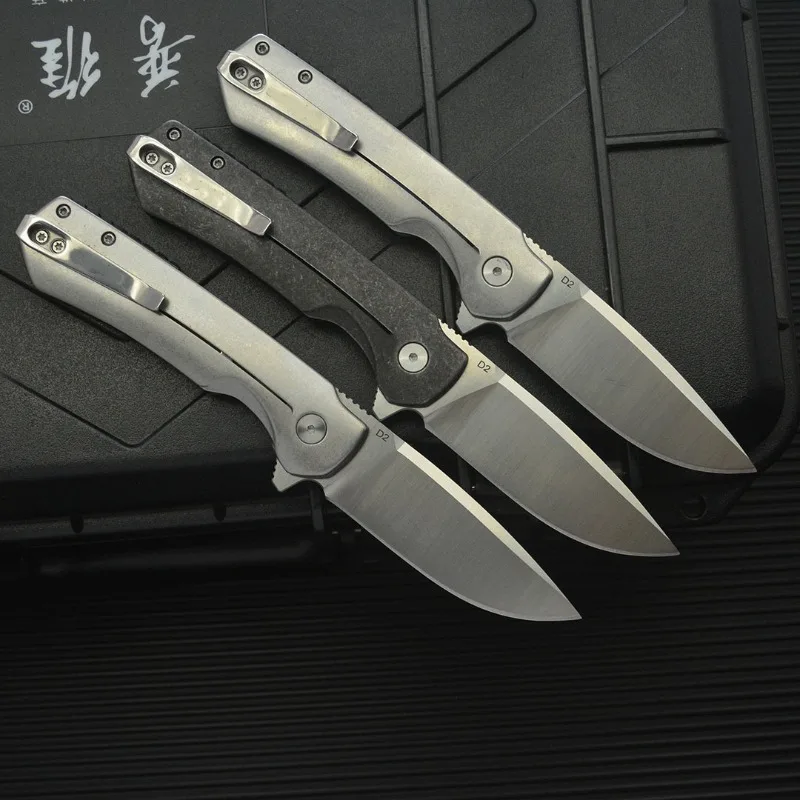Nuovo 714 Coltello pieghevole da campeggio esterno D2 Lama in acciaio + manico in fibra di carbonio Tasca di sopravvivenza Caccia tattica Coltelli da frutta Strumenti EDC