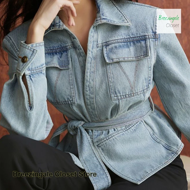 

Korean style old twill denim jacket women's autumn and winter new temperament fashion retro washed waist tie slim irregular top.