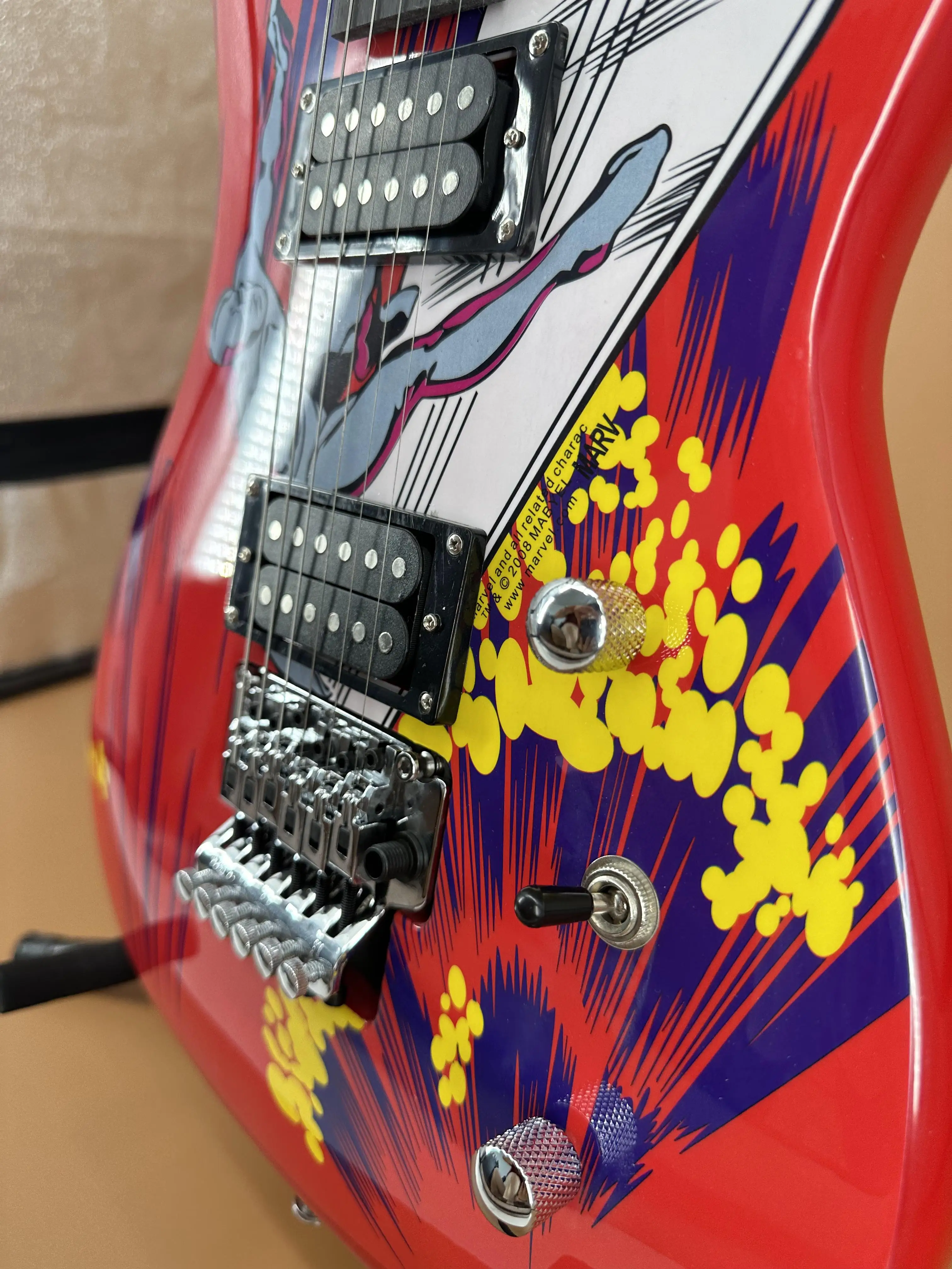 Comic Silver Shadow Hero Electric Guitar - Red Body, Yellow Explosion Pattern, Dual Pickups, Dual Vibrato System, Chrome Hardware, Dot Inlay. Christmas Gift. Ships Worldwide With Free Shipping.
