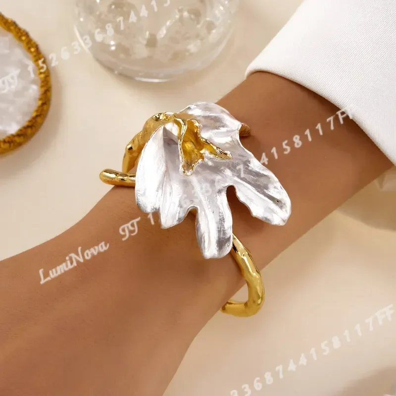 Exaggerated Metallic Bangle with Contrasting Colors Floral Design Horseshoe Lily of the Valley Openwork Details Suitable