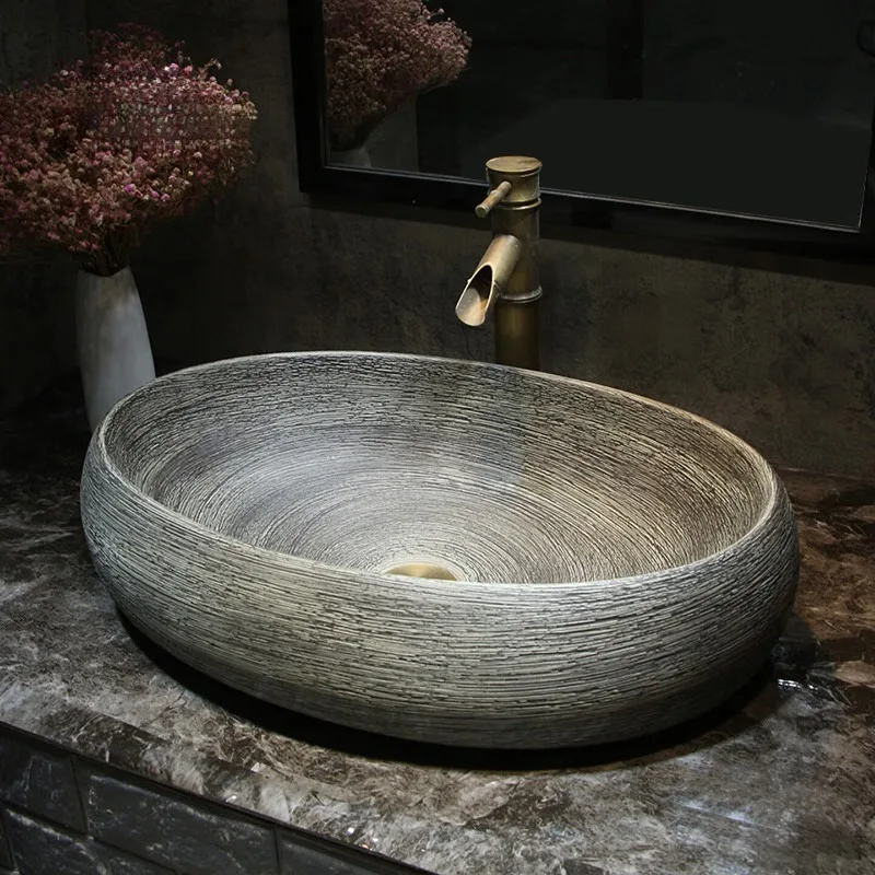 Antique engraving table basin, imitation stone ceramic wash basin, new Chinese simple wash basin, oval large household washbasin