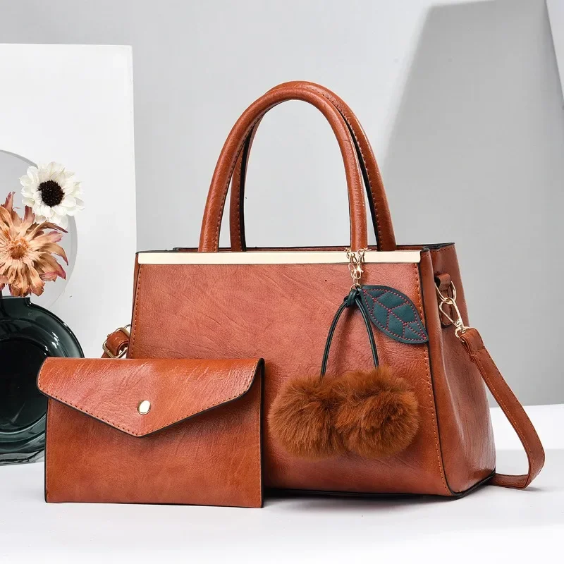 Simple Elegant Women's Handbag and Purses 2025 New Large Capacity Fur Ball Pendant Shoulder Bag High End Womens Crossbody Bags