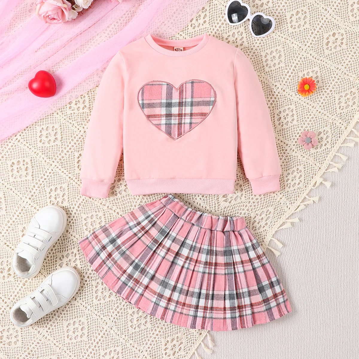 Two piece casual college style heart-shaped plaid round neck long sleeved pullover and pink short skirt for spring and autumn