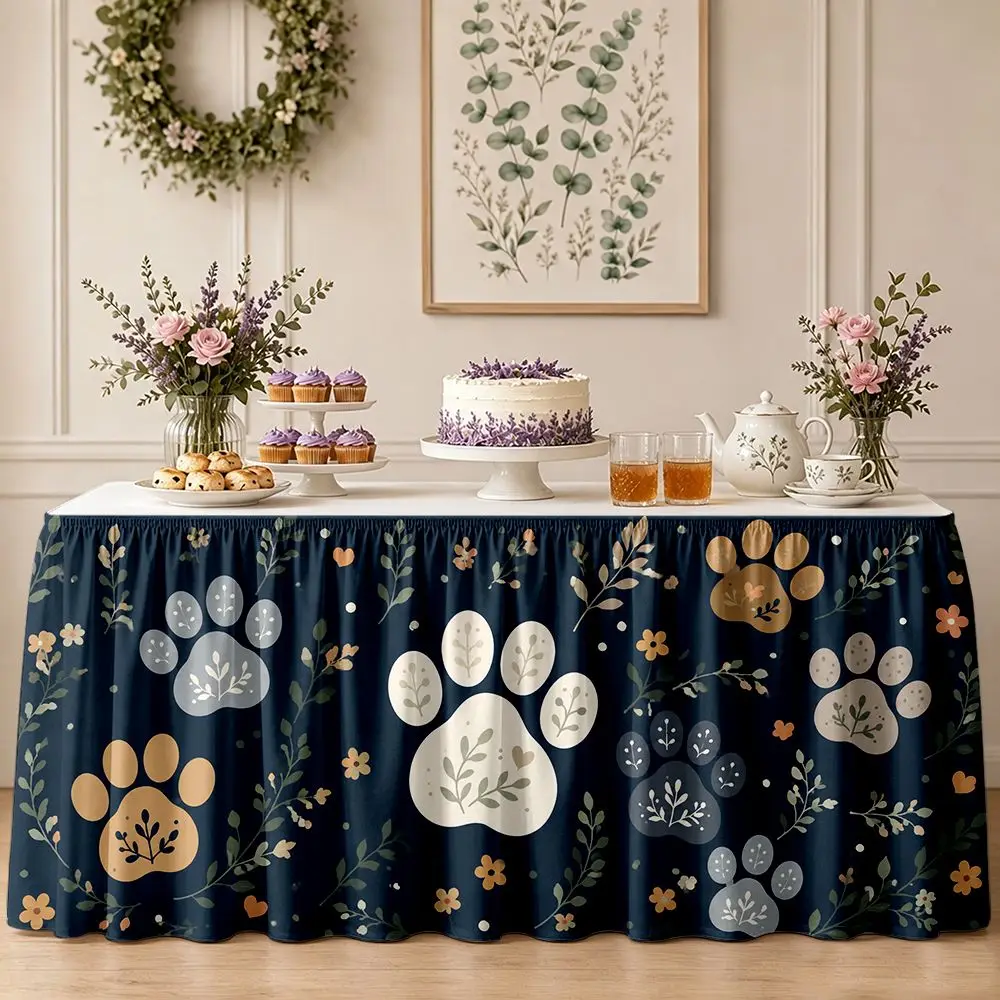 One party table skirt decoration featuring claw prints and floral patterns, with ruffled edges on the tablecloth.