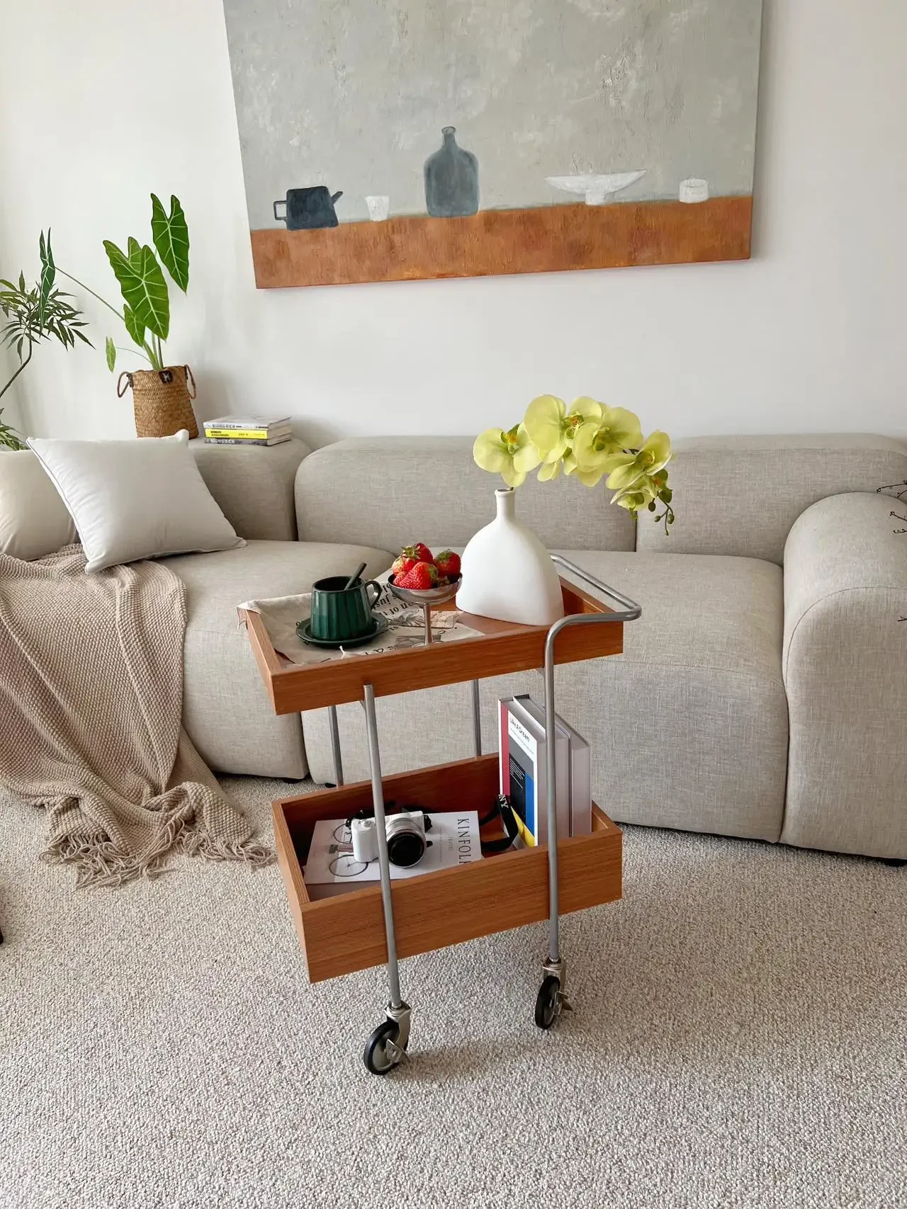 A few small-sized storage racks in the living room beside  retro cart can move the antique angle solid wood