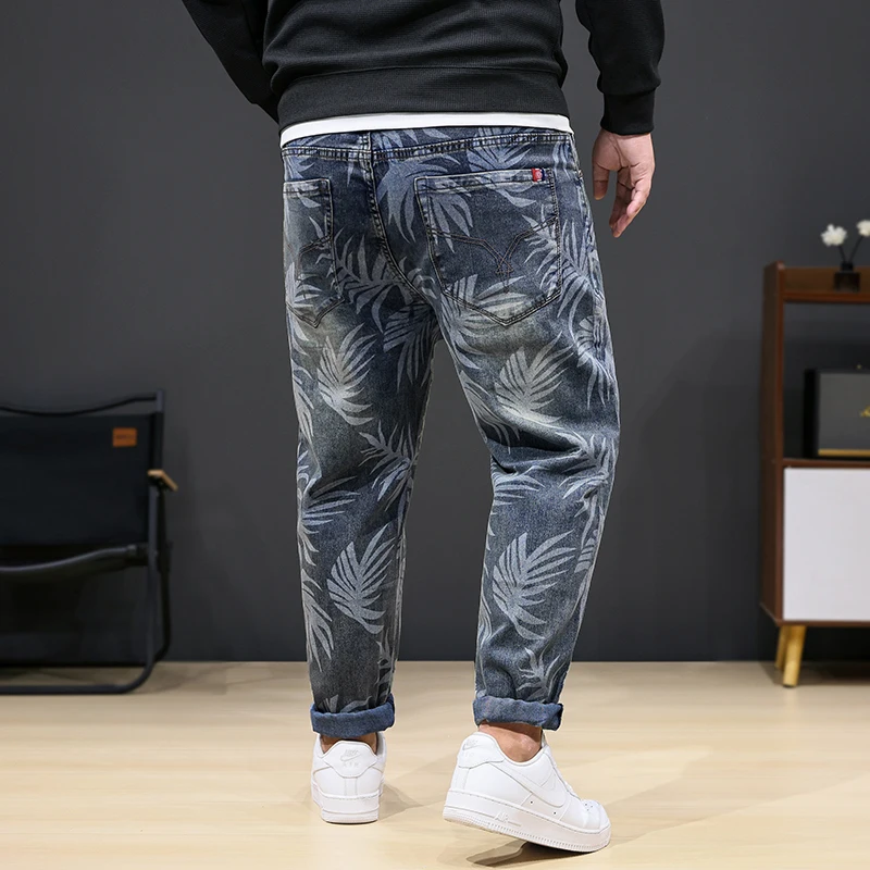 8XL oversized jeans men's fashion leaf printed trendy casual stretch denim plus sizes loose 150kg fat pants