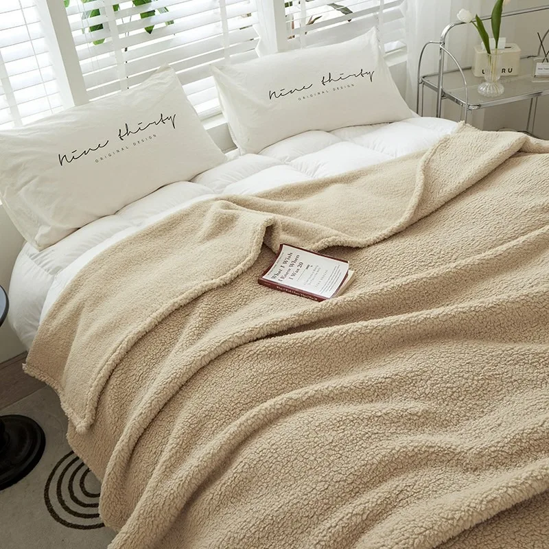 Embrace of Softness: Solid Color Coral Fleece Throw. Your All-Season Snuggle Companion for Couch & Bedside Comfort.